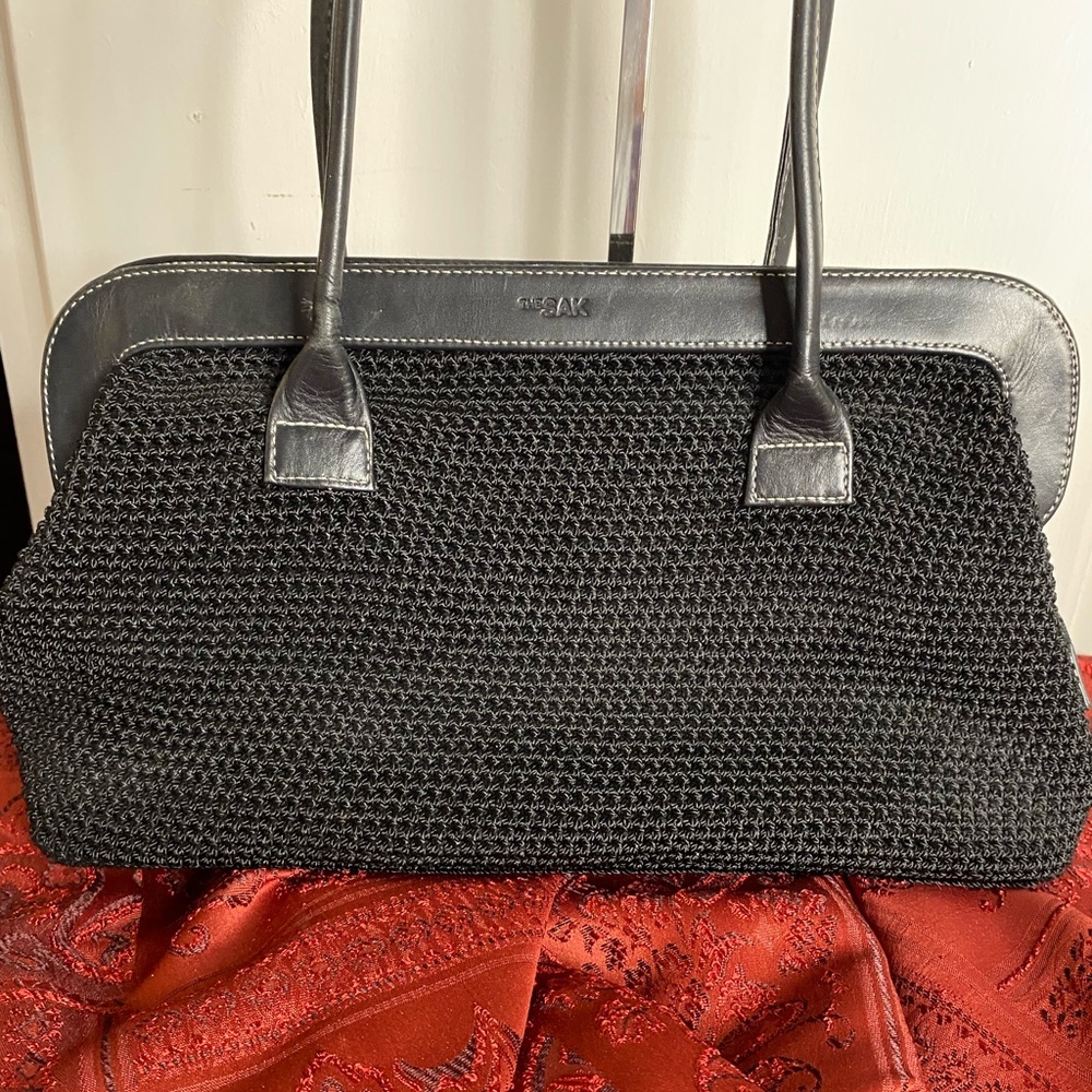 The Sak. Black Crochet Knit Woven Handbag with black lining. Great condition